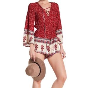 Reverse Long Sleeve Lace-Up Romper